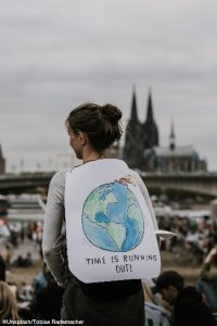 Girl protesting against fossil fuel usage