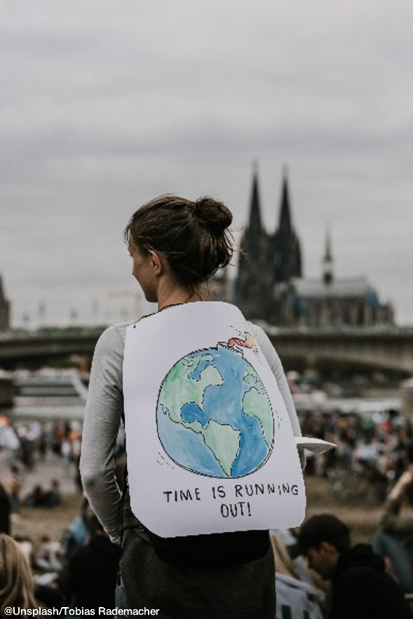 Girl protesting against fossil fuel usage
